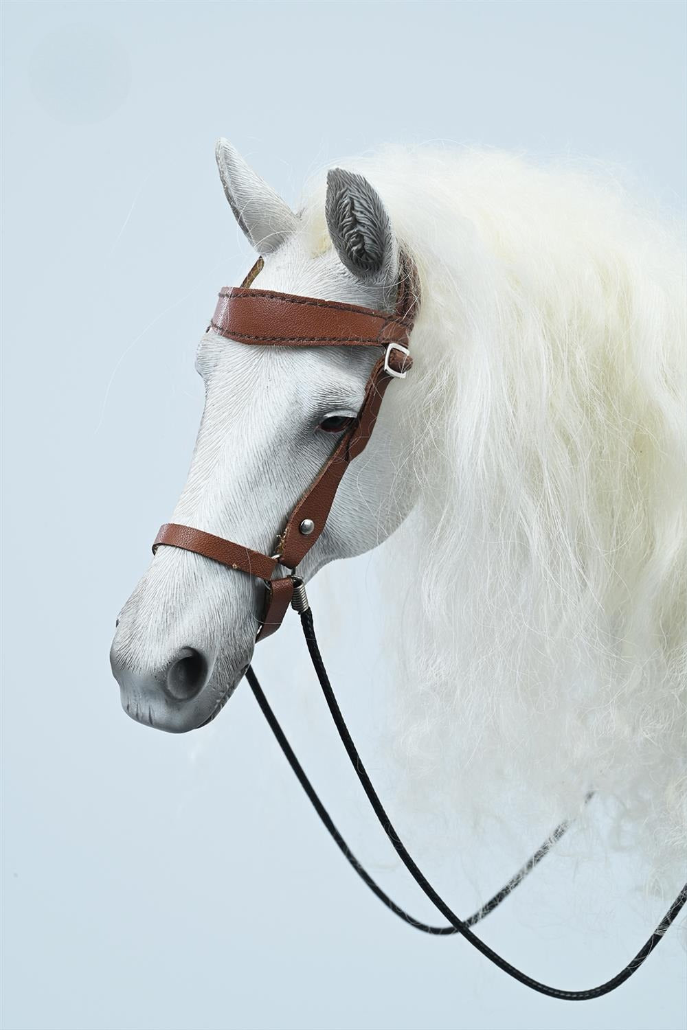 1/6 scale Akhal-Teke horse model with detailed saddle and harness, showcasing realistic craftsmanship, perfect for display in collections or as a decorative figurine for horse enthusiasts.