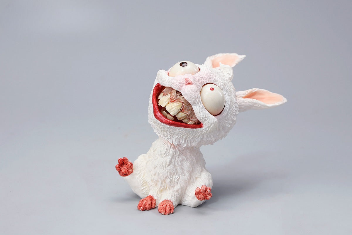 A detailed 1/6 scale creepy rabbit figurine made from durable resin, featuring a magnetic removable face, grotesque teeth, and eerie eyes. This horror-themed bunny collectible is hand-painted for a unique, chilling aesthetic, perfect for gothic decor and Halloween enthusiasts.