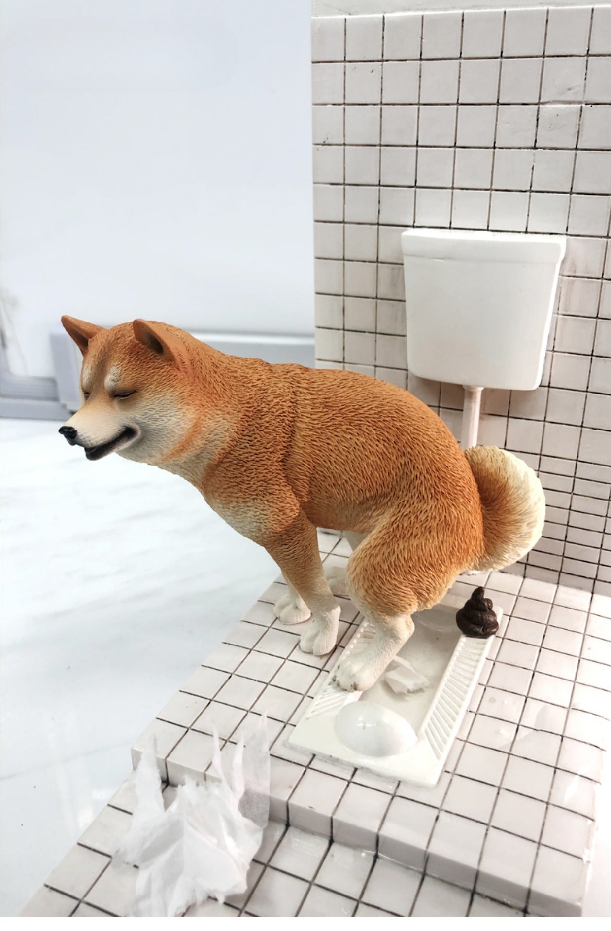 Shiba Inu figurine by urinal with realistic details, perfect for bathroom decor and dog lovers, humorous and unique collectible.