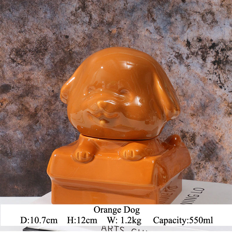 Orange ceramic dog-shaped pet urn with a glossy finish, featuring a cute dog figure on a square base, ideal for North American pet owners. This handcrafted memorial urn securely stores pet ashes, perfect for home display on mantels or shelves, offering a dignified tribute with its vibrant color and unique design.