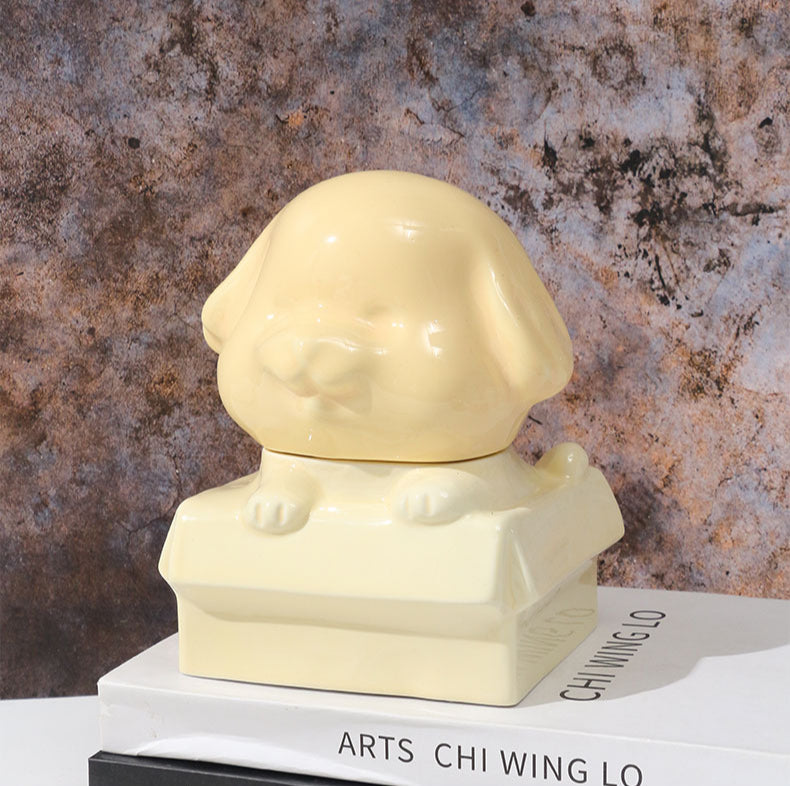 Orange ceramic dog-shaped pet urn with a glossy finish, featuring a cute dog figure on a square base, ideal for North American pet owners. This handcrafted memorial urn securely stores pet ashes, perfect for home display on mantels or shelves, offering a dignified tribute with its vibrant color and unique design.