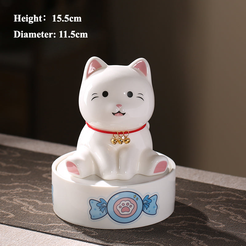 A ceramic pet memorial urn in the shape of a cat, designed to hold ashes with intricate details, such as a red collar and golden bells, offering a comforting tribute to a pet's life. This urn serves as a beautiful and lasting memorial for beloved pets.