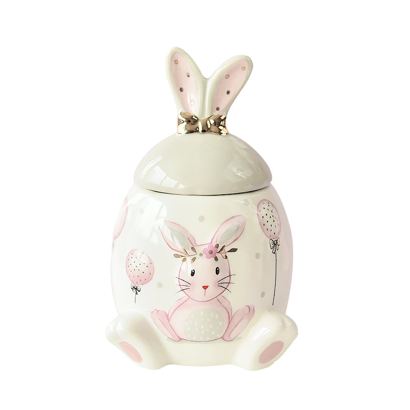Cute pink and gold bunny ceramic urn for pets, perfect for storing ashes of cats and dogs. Features floral and balloon designs with an airtight seal. A loving tribute to your pet’s memory and a decorative addition to your home.