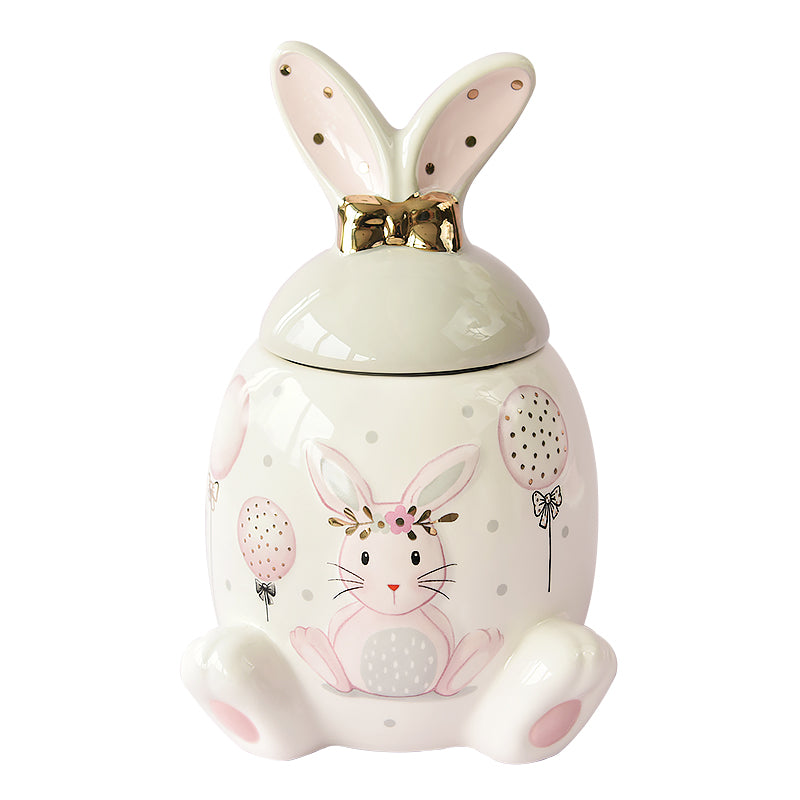 Cute pink and gold bunny ceramic urn for pets, perfect for storing ashes of cats and dogs. Features floral and balloon designs with an airtight seal. A loving tribute to your pet’s memory and a decorative addition to your home.