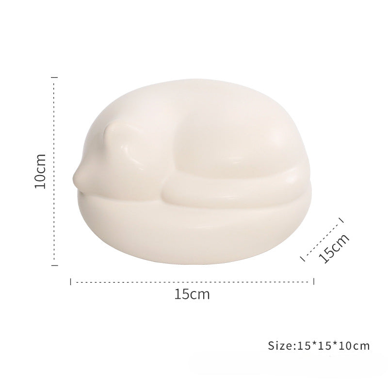 Pet memorial box with ceramic design featuring a resting sleeping pose and winged accents, perfect for storing pet ashes. Comes with additional accessories like a flower holder and incense holder for personalized tribute. Ideal for dogs and cats as a lasting keepsake