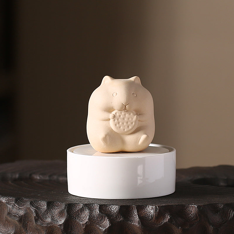 An adorable hamster-shaped cremation urn designed for small pets. The high-quality ceramic urn features a cute hamster figurine and provides a peaceful resting place for your pet's ashes. A comforting and personalized memorial for hamster owners.