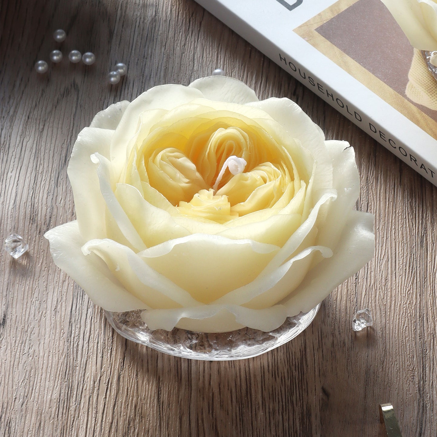 A luxurious handmade Austin Rose scented candle in an elegant gift box, featuring a beautiful rose design. This high-end candle offers a calming fragrance that enhances home decor and provides a relaxing ambiance. A perfect gift for special occasions such as birthdays or anniversaries.