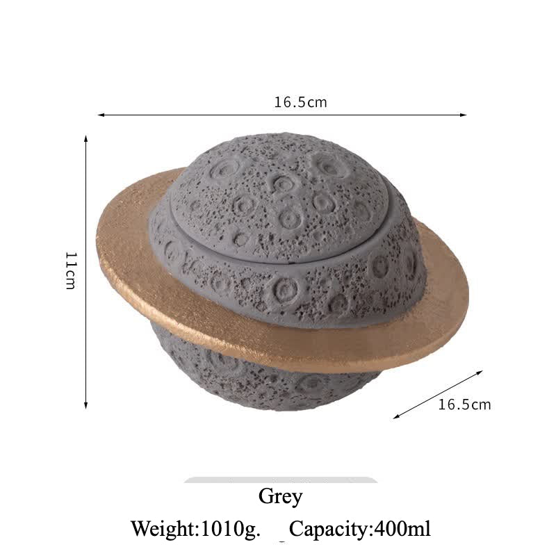 Discover the Pink Saturn-Shaped Pet Urn, a heartfelt memorial ashes holder crafted from durable Portland cement for North American pet owners. This whimsical planet-inspired design in soft pink, complete with a gold ring and textured craters, offers secure storage for up to 400ml of ashes from small pets. Measuring 16.5cm wide and 11cm tall, it weighs 1010g and fits perfectly on shelves or mantels, blending seamlessly into home decor. Ideal for cat or dog lovers seeking a unique tribute, it addresses grief