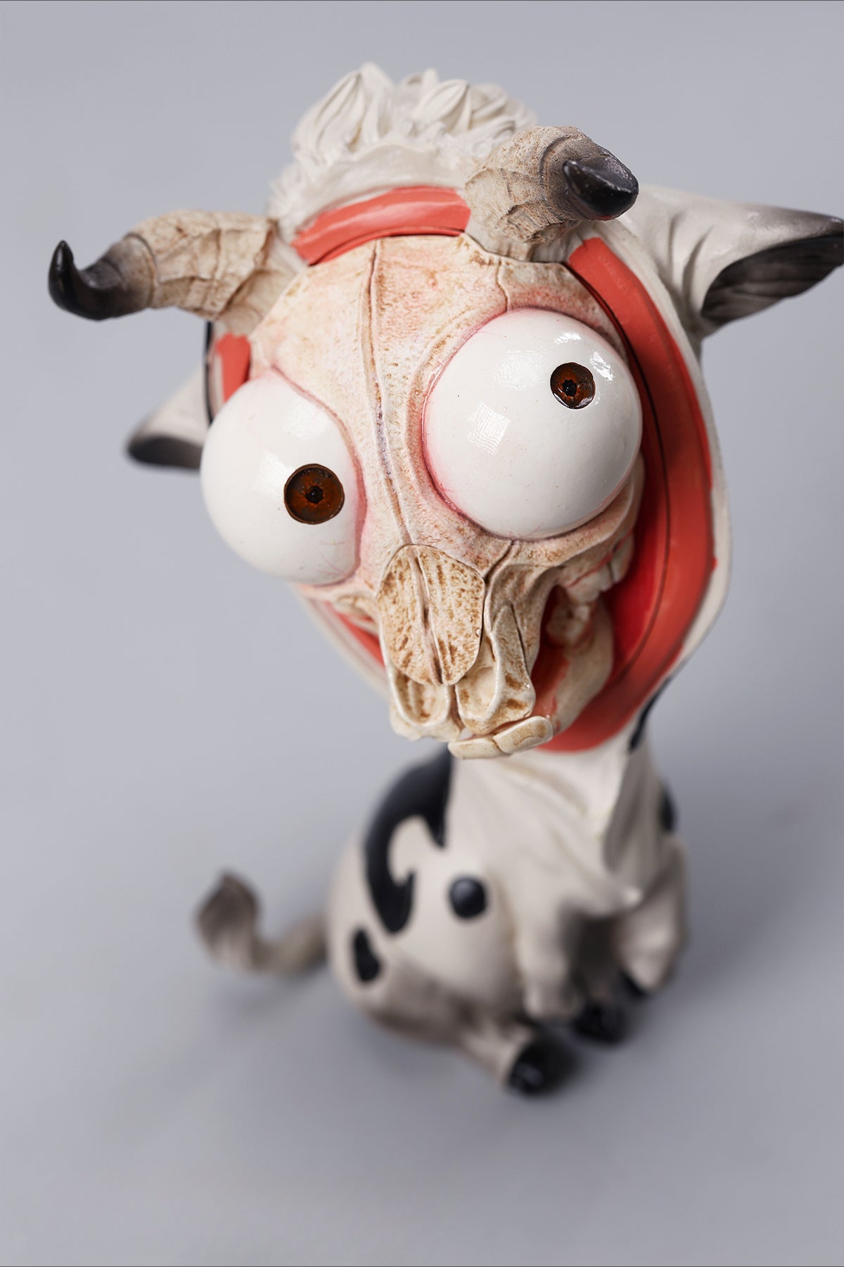 A detailed hand-painted ox figurine from the 12 Chinese Zodiac collection featuring a quirky removable face, premium resin material, and intricate artistic details. A perfect collector’s item and home decor piece for zodiac enthusiasts.