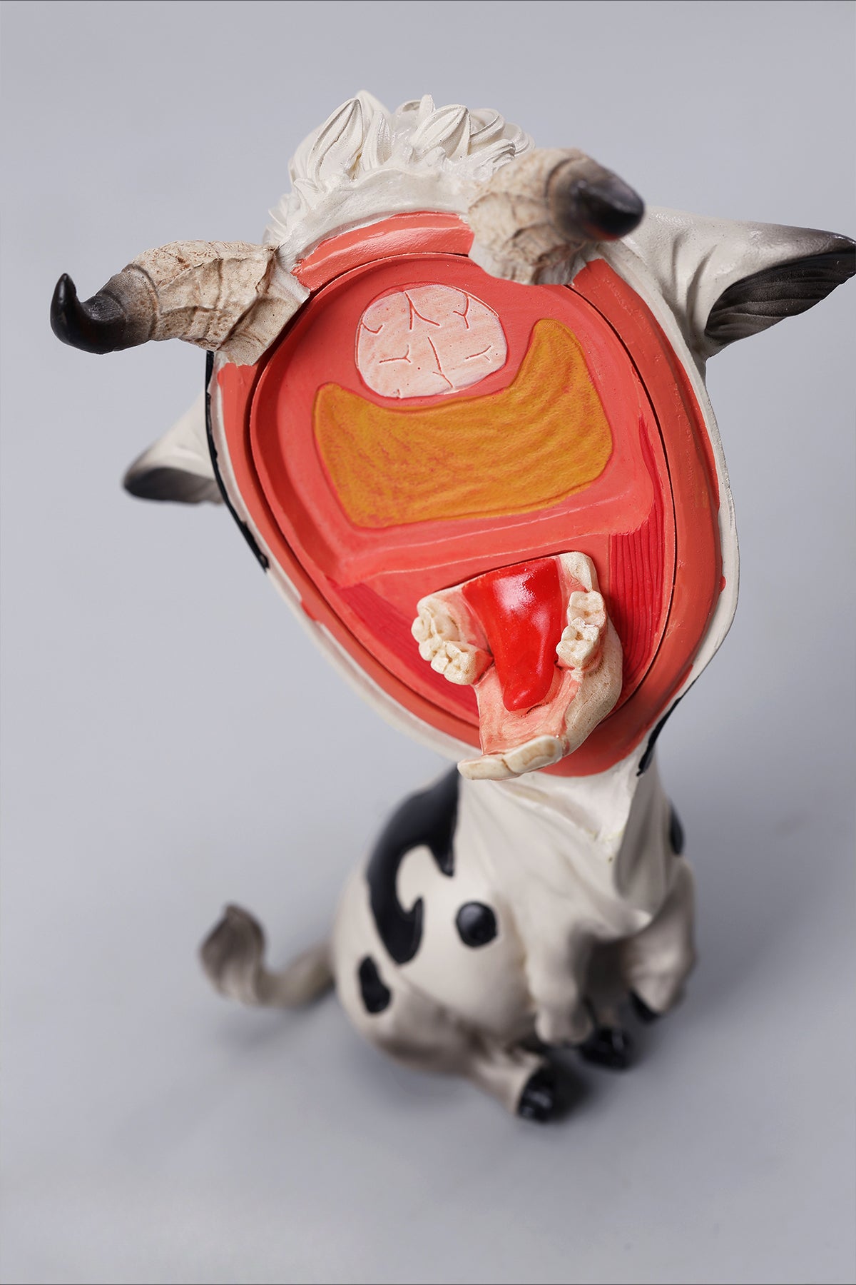 A detailed hand-painted ox figurine from the 12 Chinese Zodiac collection featuring a quirky removable face, premium resin material, and intricate artistic details. A perfect collector’s item and home decor piece for zodiac enthusiasts.