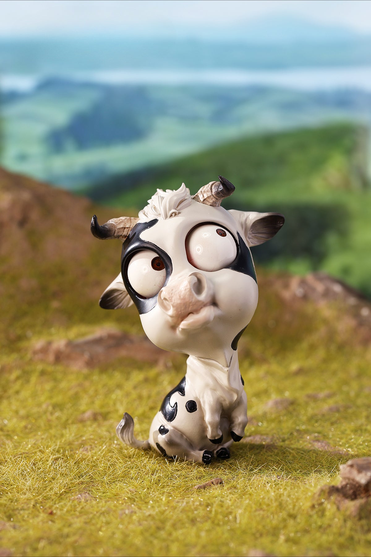 A detailed hand-painted ox figurine from the 12 Chinese Zodiac collection featuring a quirky removable face, premium resin material, and intricate artistic details. A perfect collector’s item and home decor piece for zodiac enthusiasts.