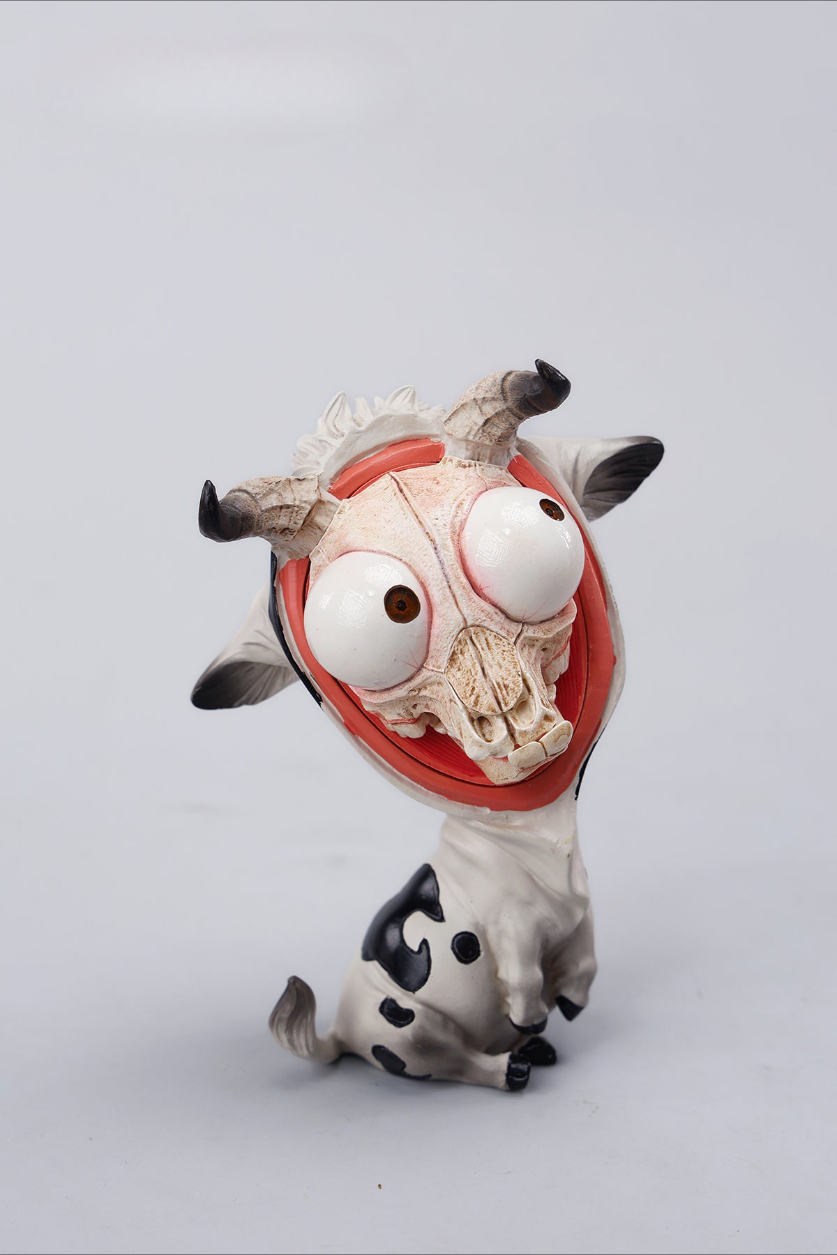 A detailed hand-painted ox figurine from the 12 Chinese Zodiac collection featuring a quirky removable face, premium resin material, and intricate artistic details. A perfect collector’s item and home decor piece for zodiac enthusiasts.