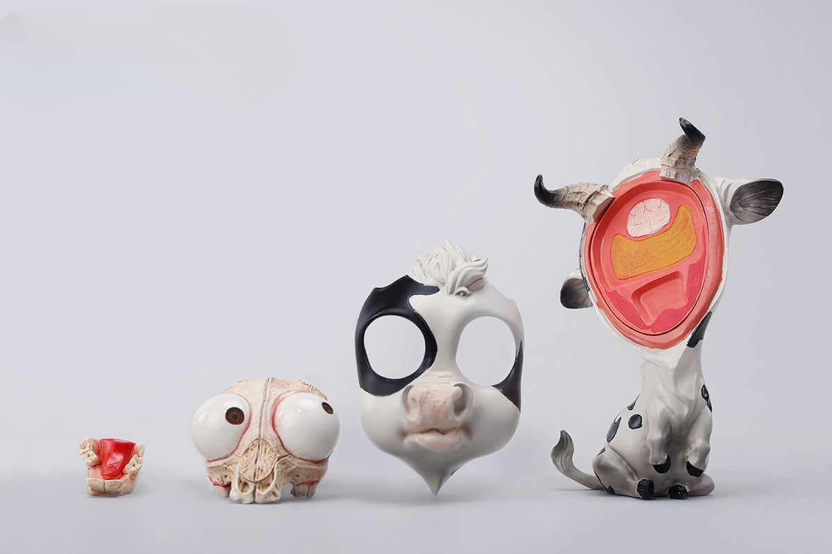 A detailed hand-painted ox figurine from the 12 Chinese Zodiac collection featuring a quirky removable face, premium resin material, and intricate artistic details. A perfect collector’s item and home decor piece for zodiac enthusiasts.