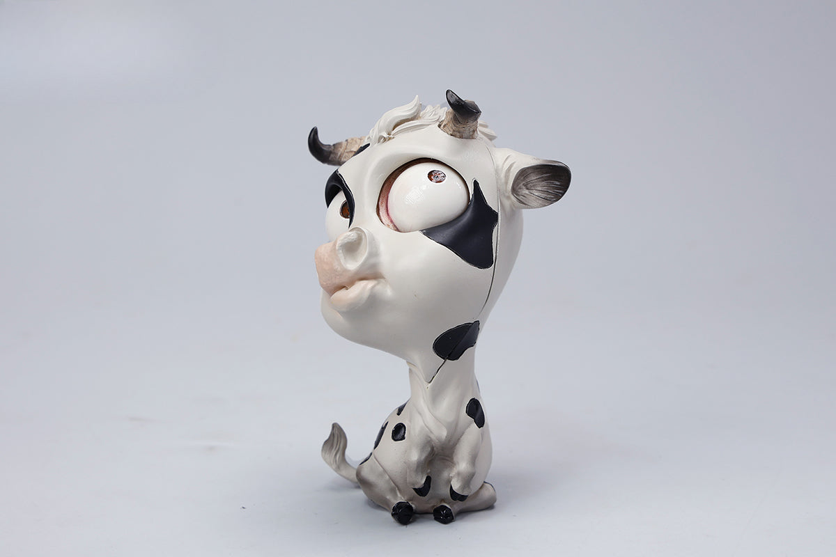 A detailed hand-painted ox figurine from the 12 Chinese Zodiac collection featuring a quirky removable face, premium resin material, and intricate artistic details. A perfect collector’s item and home decor piece for zodiac enthusiasts.