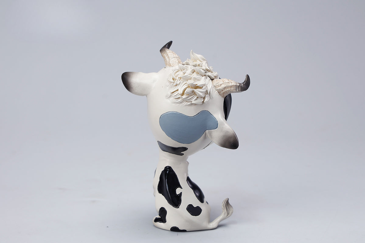 A detailed hand-painted ox figurine from the 12 Chinese Zodiac collection featuring a quirky removable face, premium resin material, and intricate artistic details. A perfect collector’s item and home decor piece for zodiac enthusiasts.