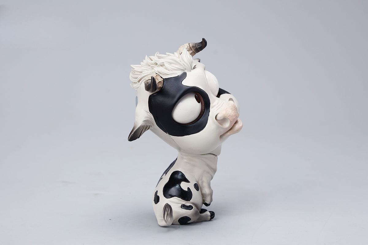 A detailed hand-painted ox figurine from the 12 Chinese Zodiac collection featuring a quirky removable face, premium resin material, and intricate artistic details. A perfect collector’s item and home decor piece for zodiac enthusiasts.