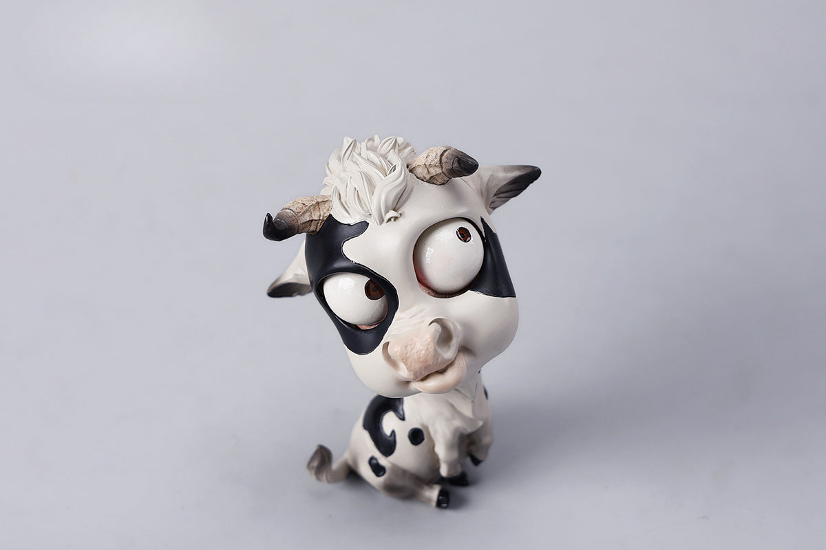 A detailed hand-painted ox figurine from the 12 Chinese Zodiac collection featuring a quirky removable face, premium resin material, and intricate artistic details. A perfect collector’s item and home decor piece for zodiac enthusiasts.