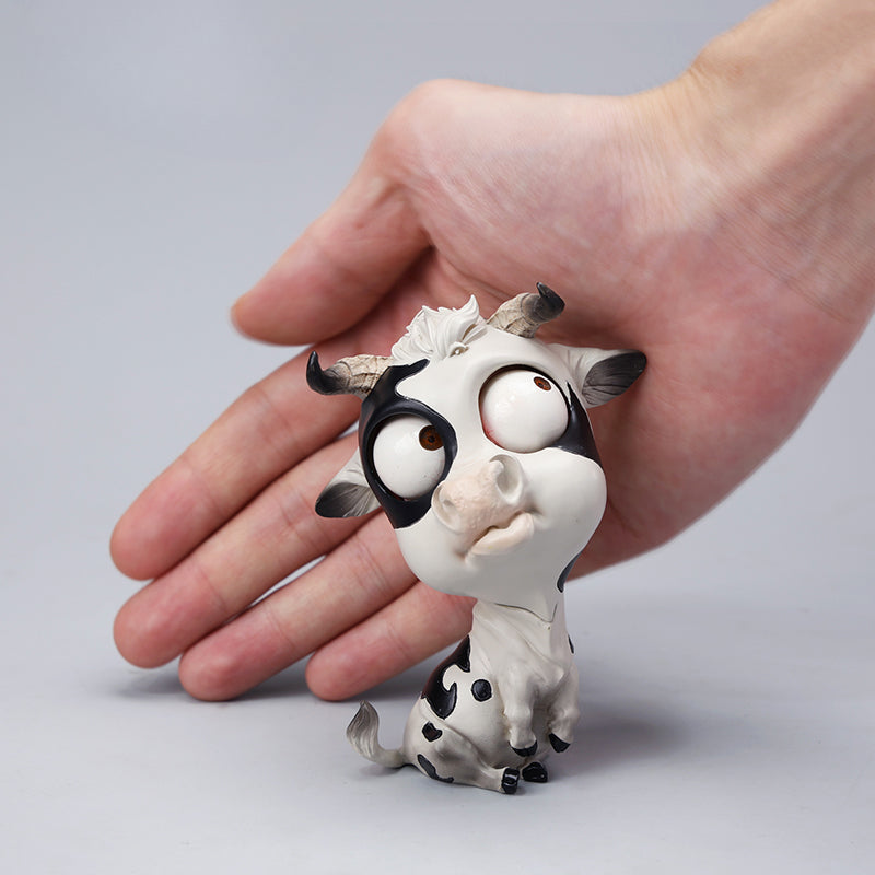 A detailed hand-painted ox figurine from the 12 Chinese Zodiac collection featuring a quirky removable face, premium resin material, and intricate artistic details. A perfect collector’s item and home decor piece for zodiac enthusiasts.