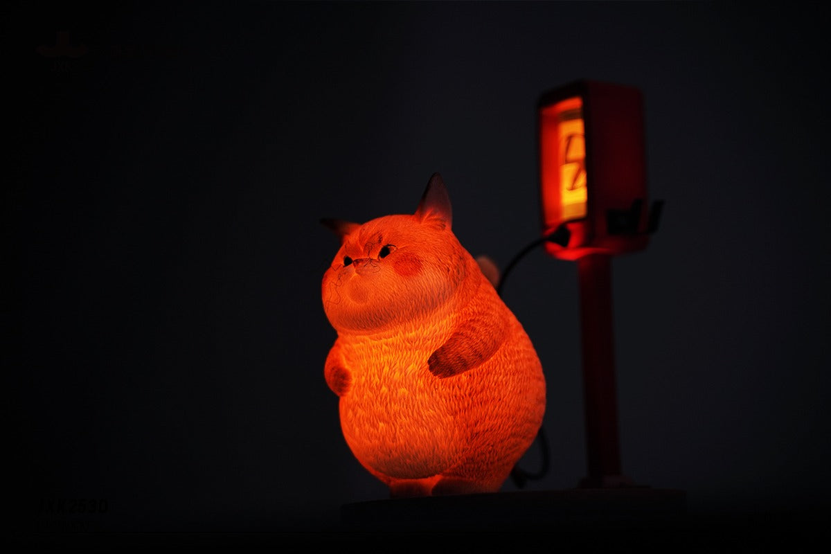 This ElectroCat Charging Station Figurine features a cute cat with a charging pump made from high-quality vinyl. The charging platform adds functionality, allowing the figurine to light up, making it a unique home decor piece and interactive collectible for cat lovers and collectors.