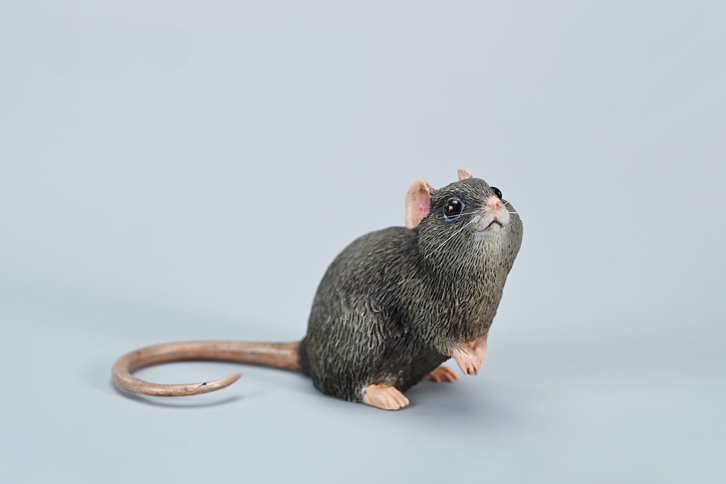 This image showcases a highly detailed, lifelike mouse figurine, part of the Pre-sale 1/1 Small Simulation Mouse Model collection. The model features a realistic depiction with intricate fur texture, expressive eyes, and delicate paws, highlighting its craftsmanship. The mouse is posed naturally, making it a perfect addition to any animal lover's collection.