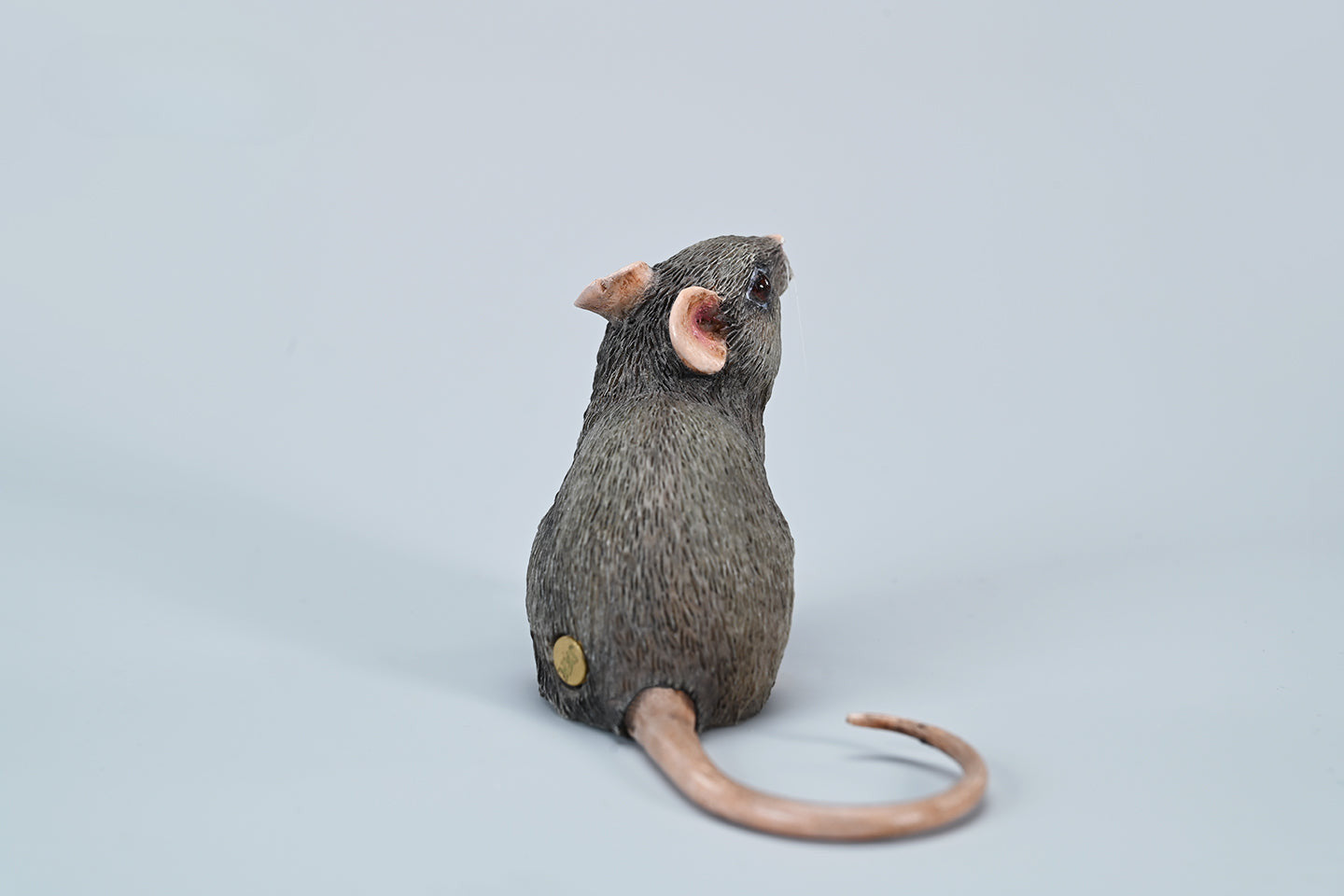 This image showcases a highly detailed, lifelike mouse figurine, part of the Pre-sale 1/1 Small Simulation Mouse Model collection. The model features a realistic depiction with intricate fur texture, expressive eyes, and delicate paws, highlighting its craftsmanship. The mouse is posed naturally, making it a perfect addition to any animal lover's collection.