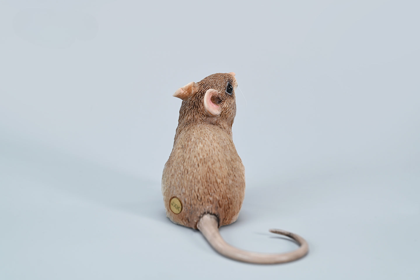 This image showcases a highly detailed, lifelike mouse figurine, part of the Pre-sale 1/1 Small Simulation Mouse Model collection. The model features a realistic depiction with intricate fur texture, expressive eyes, and delicate paws, highlighting its craftsmanship. The mouse is posed naturally, making it a perfect addition to any animal lover's collection.