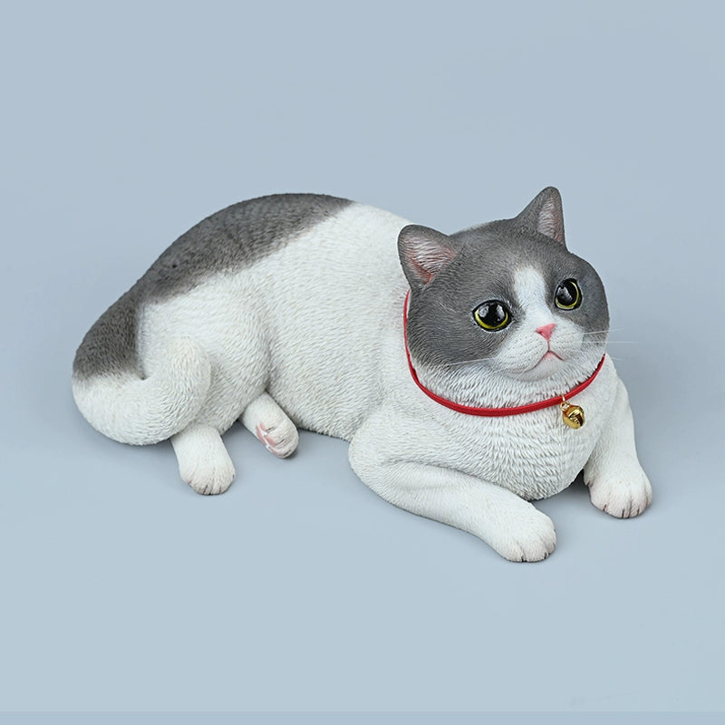 Realistic 1/3 British Shorthair Cat Simulation Animal Model featuring a lifelike design with intricate details. The model showcases a British Shorthair in a relaxed pose, highlighting its characteristic short, plush coat and rounded face. Perfect for collectors and cat enthusiasts.