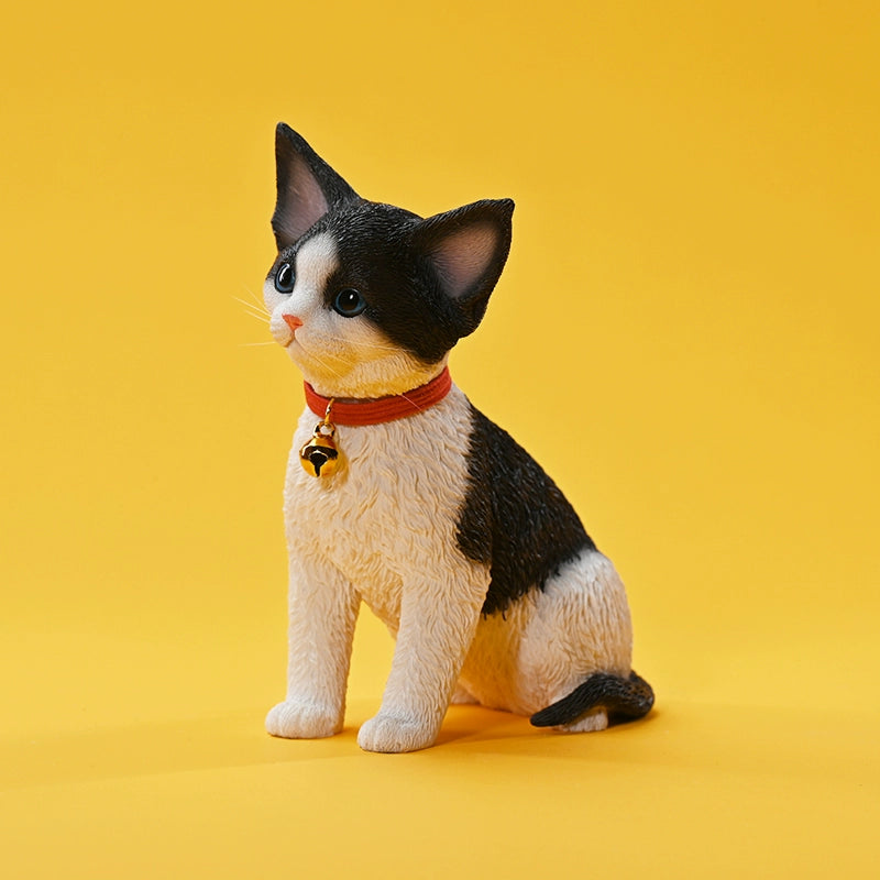 A set of 1/3 scale German Curly Cat resin models featuring five cats with distinct fur colors and patterns. The cats are shown sitting attentively around a pair of human legs, wearing red collars with bells. The scene is set against a yellow background.
