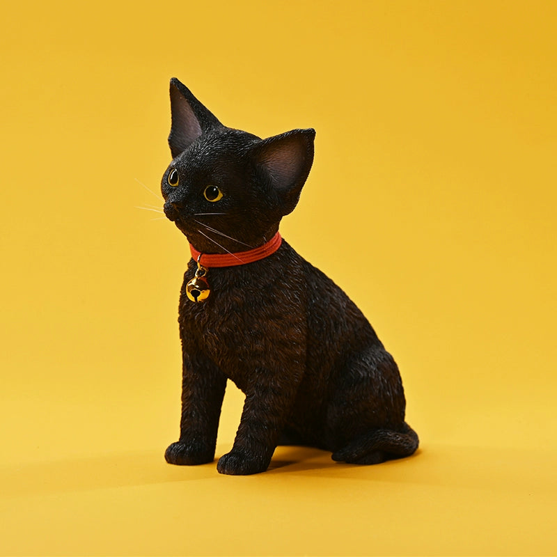 A set of 1/3 scale German Curly Cat resin models featuring five cats with distinct fur colors and patterns. The cats are shown sitting attentively around a pair of human legs, wearing red collars with bells. The scene is set against a yellow background.