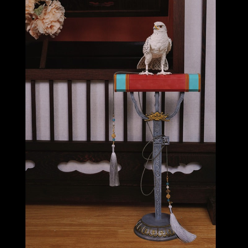 A 1/3 scale realistic resin Falcon bird figurine perched on a display stand, featuring intricate feather detailing, a fierce expression, and a movable head for dynamic display, ideal for wildlife collectors and bird art love