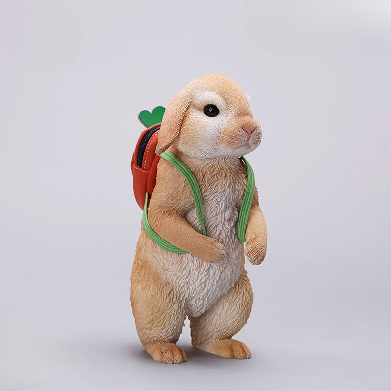 Adorable 1/4 scale American Lop Rabbit figurine with a removable carrot backpack, hand-painted with high detail. Perfect for animal lovers and collectors, showcasing the rabbit’s playful nature and lifelike texture. Ideal for display on shelves or as a gift.