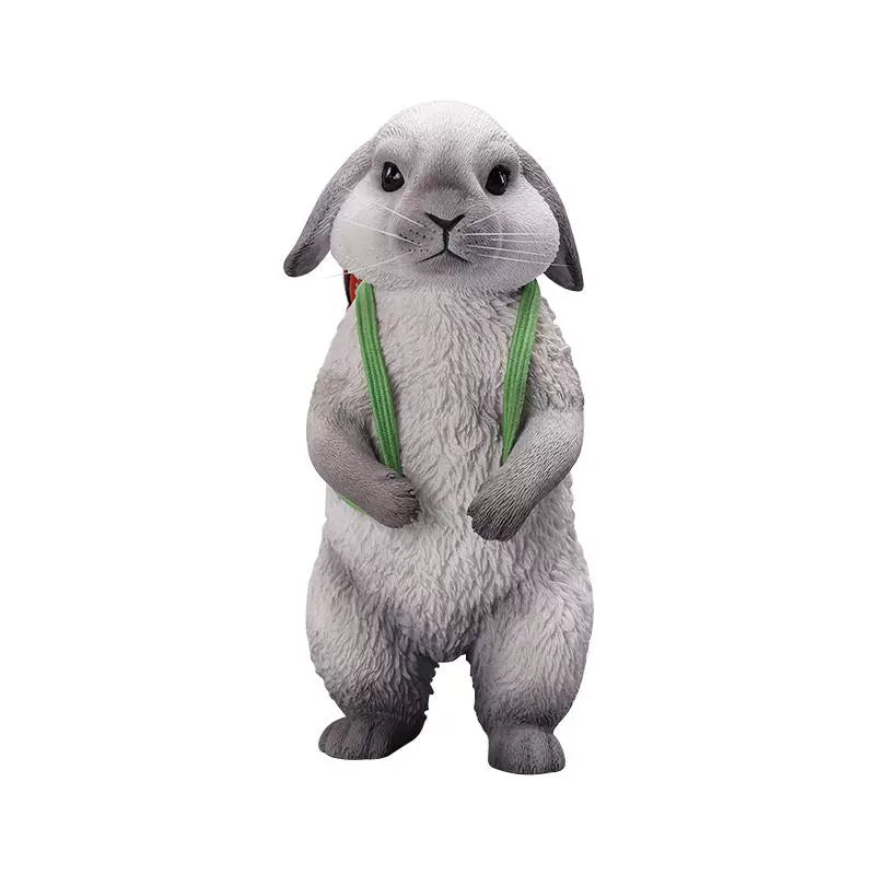 Adorable 1/4 scale American Lop Rabbit figurine with a removable carrot backpack, hand-painted with high detail. Perfect for animal lovers and collectors, showcasing the rabbit’s playful nature and lifelike texture. Ideal for display on shelves or as a gift.