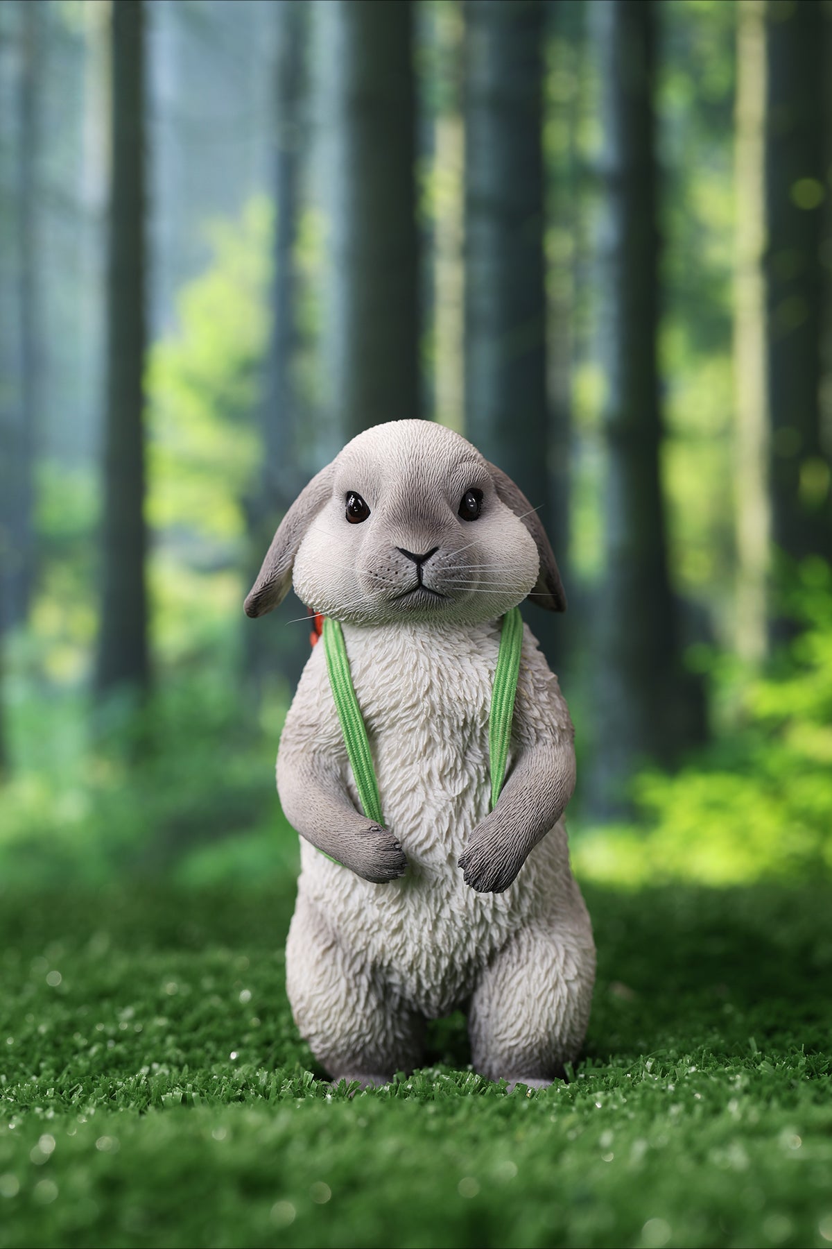 Adorable 1/4 scale American Lop Rabbit figurine with a removable carrot backpack, hand-painted with high detail. Perfect for animal lovers and collectors, showcasing the rabbit’s playful nature and lifelike texture. Ideal for display on shelves or as a gift.