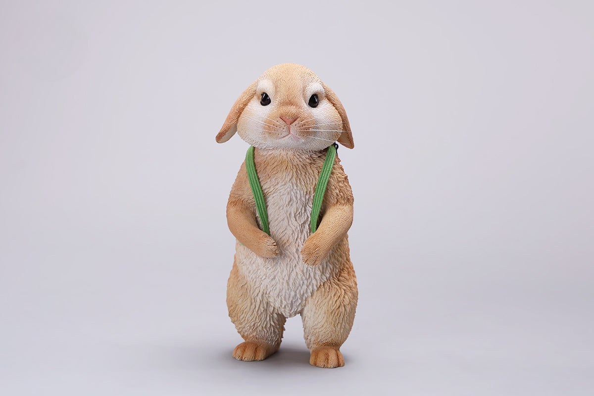 Adorable 1/4 scale American Lop Rabbit figurine with a removable carrot backpack, hand-painted with high detail. Perfect for animal lovers and collectors, showcasing the rabbit’s playful nature and lifelike texture. Ideal for display on shelves or as a gift.