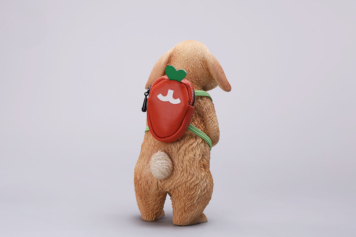 Adorable 1/4 scale American Lop Rabbit figurine with a removable carrot backpack, hand-painted with high detail. Perfect for animal lovers and collectors, showcasing the rabbit’s playful nature and lifelike texture. Ideal for display on shelves or as a gift.