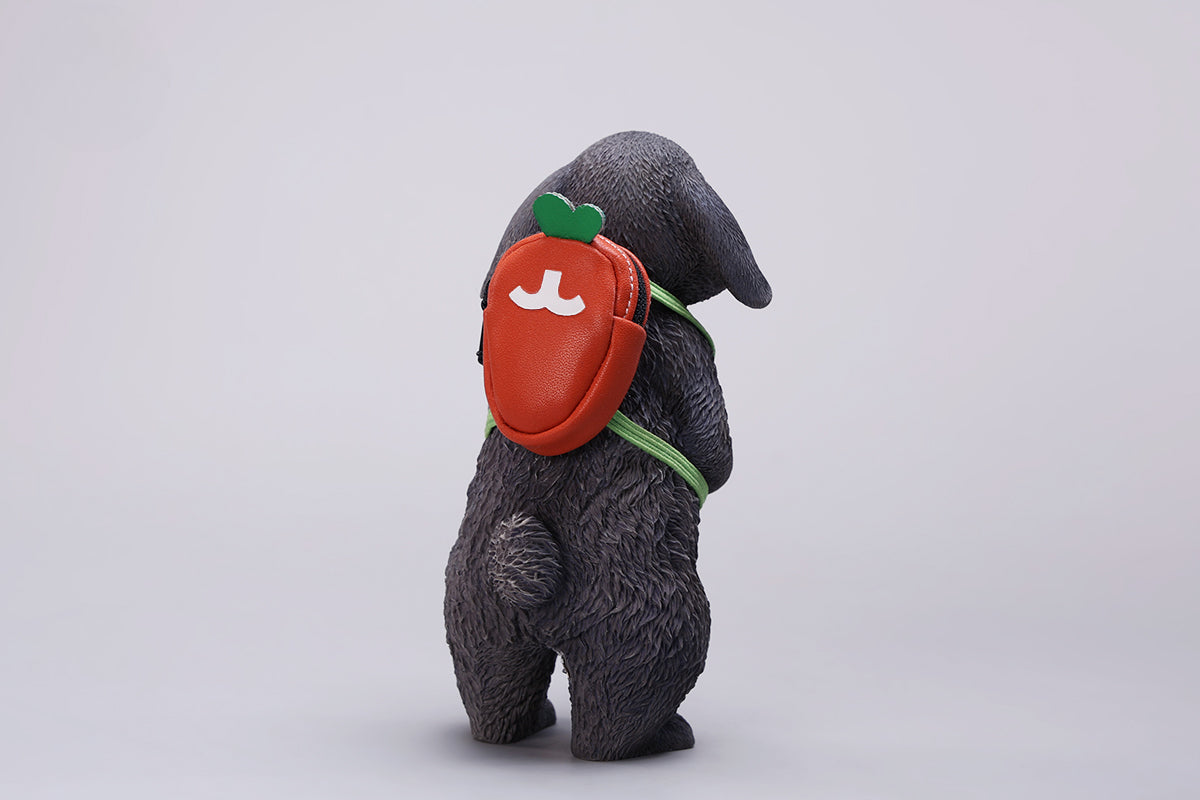 Adorable 1/4 scale American Lop Rabbit figurine with a removable carrot backpack, hand-painted with high detail. Perfect for animal lovers and collectors, showcasing the rabbit’s playful nature and lifelike texture. Ideal for display on shelves or as a gift.