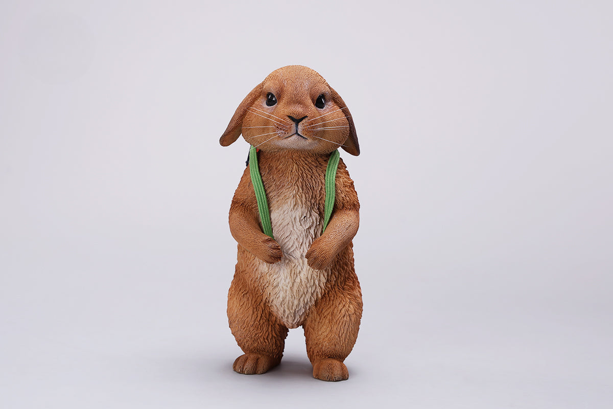 Adorable 1/4 scale American Lop Rabbit figurine with a removable carrot backpack, hand-painted with high detail. Perfect for animal lovers and collectors, showcasing the rabbit’s playful nature and lifelike texture. Ideal for display on shelves or as a gift.
