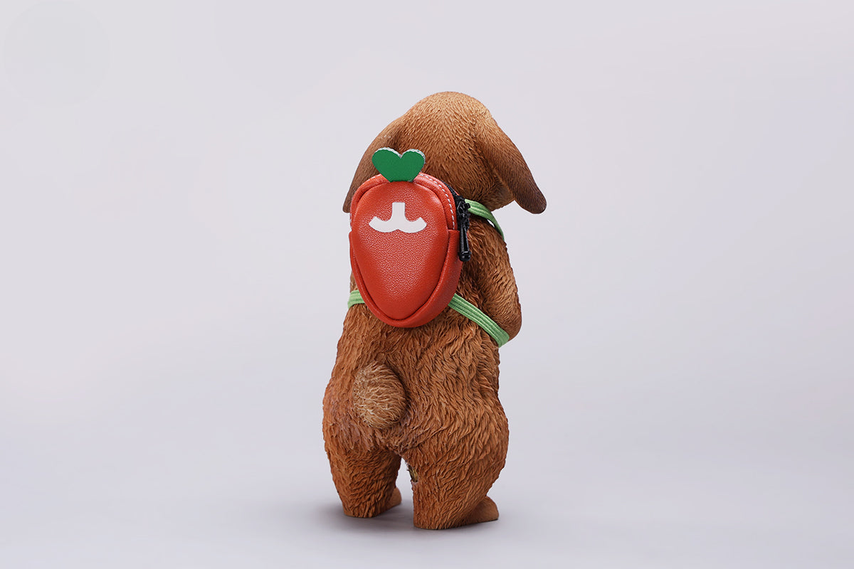 Adorable 1/4 scale American Lop Rabbit figurine with a removable carrot backpack, hand-painted with high detail. Perfect for animal lovers and collectors, showcasing the rabbit’s playful nature and lifelike texture. Ideal for display on shelves or as a gift.