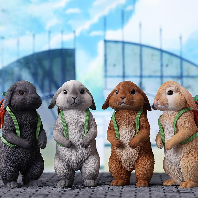 Adorable 1/4 scale American Lop Rabbit figurine with a removable carrot backpack, hand-painted with high detail. Perfect for animal lovers and collectors, showcasing the rabbit’s playful nature and lifelike texture. Ideal for display on shelves or as a gift.