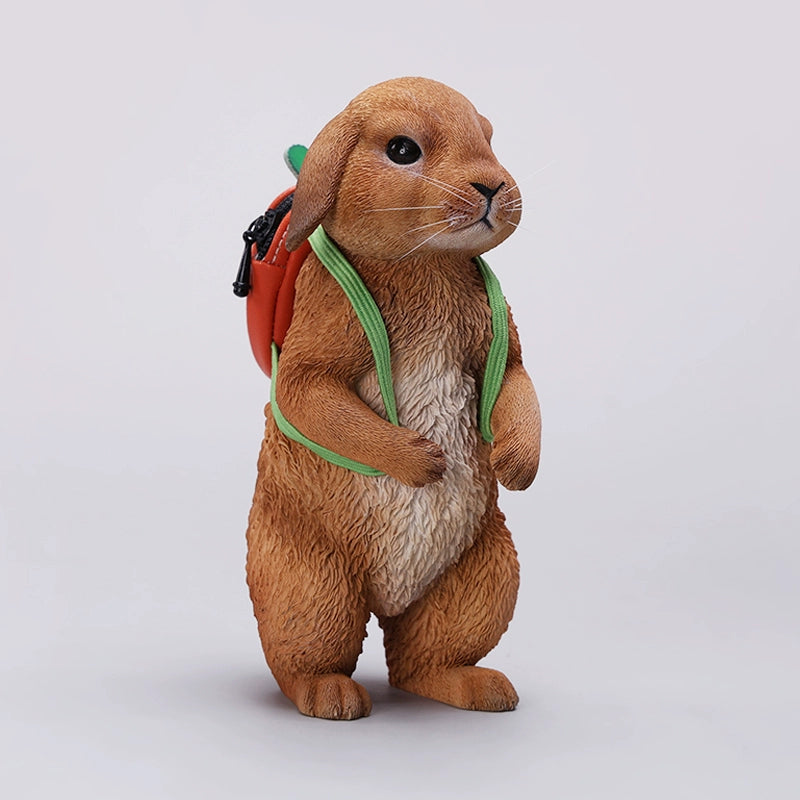 Adorable 1/4 scale American Lop Rabbit figurine with a removable carrot backpack, hand-painted with high detail. Perfect for animal lovers and collectors, showcasing the rabbit’s playful nature and lifelike texture. Ideal for display on shelves or as a gift.