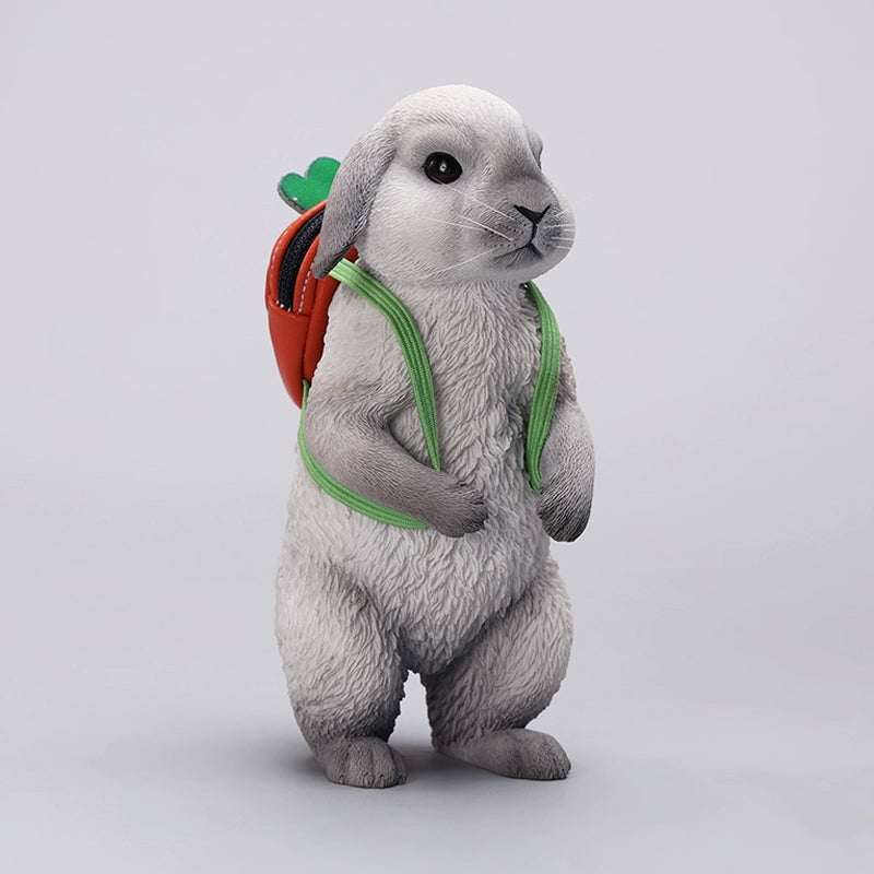 Adorable 1/4 scale American Lop Rabbit figurine with a removable carrot backpack, hand-painted with high detail. Perfect for animal lovers and collectors, showcasing the rabbit’s playful nature and lifelike texture. Ideal for display on shelves or as a gift.