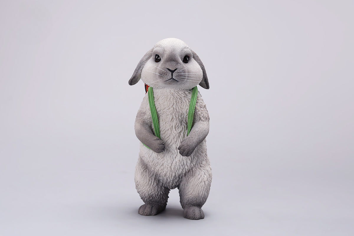 Adorable 1/4 scale American Lop Rabbit figurine with a removable carrot backpack, hand-painted with high detail. Perfect for animal lovers and collectors, showcasing the rabbit’s playful nature and lifelike texture. Ideal for display on shelves or as a gift.