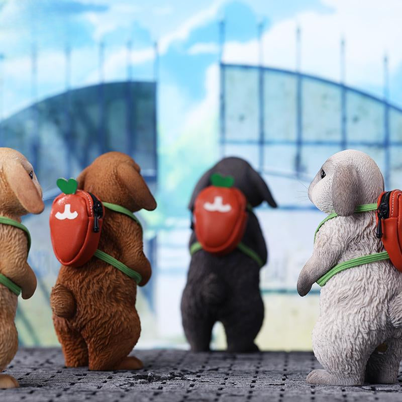 Adorable 1/4 scale American Lop Rabbit figurine with a removable carrot backpack, hand-painted with high detail. Perfect for animal lovers and collectors, showcasing the rabbit’s playful nature and lifelike texture. Ideal for display on shelves or as a gift.