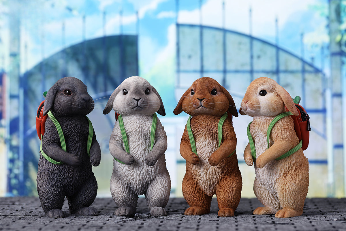 Adorable 1/4 scale American Lop Rabbit figurine with a removable carrot backpack, hand-painted with high detail. Perfect for animal lovers and collectors, showcasing the rabbit’s playful nature and lifelike texture. Ideal for display on shelves or as a gift.