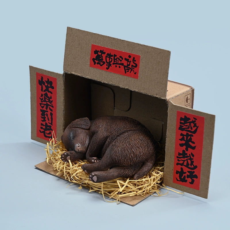 A realistic and finely detailed 1/4 scale model of a Labrador dog in a sleeping position, displayed with traditional Chinese decorations in the background. The model showcases the Labrador in various coat colors, lying peacefully on a bed of straw, with intricate textures capturing the essence of the dog's fur and serene expression.