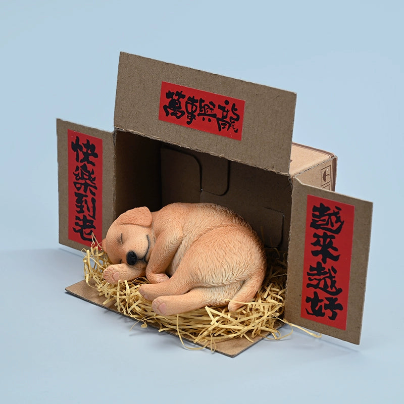 A realistic and finely detailed 1/4 scale model of a Labrador dog in a sleeping position, displayed with traditional Chinese decorations in the background. The model showcases the Labrador in various coat colors, lying peacefully on a bed of straw, with intricate textures capturing the essence of the dog's fur and serene expression.