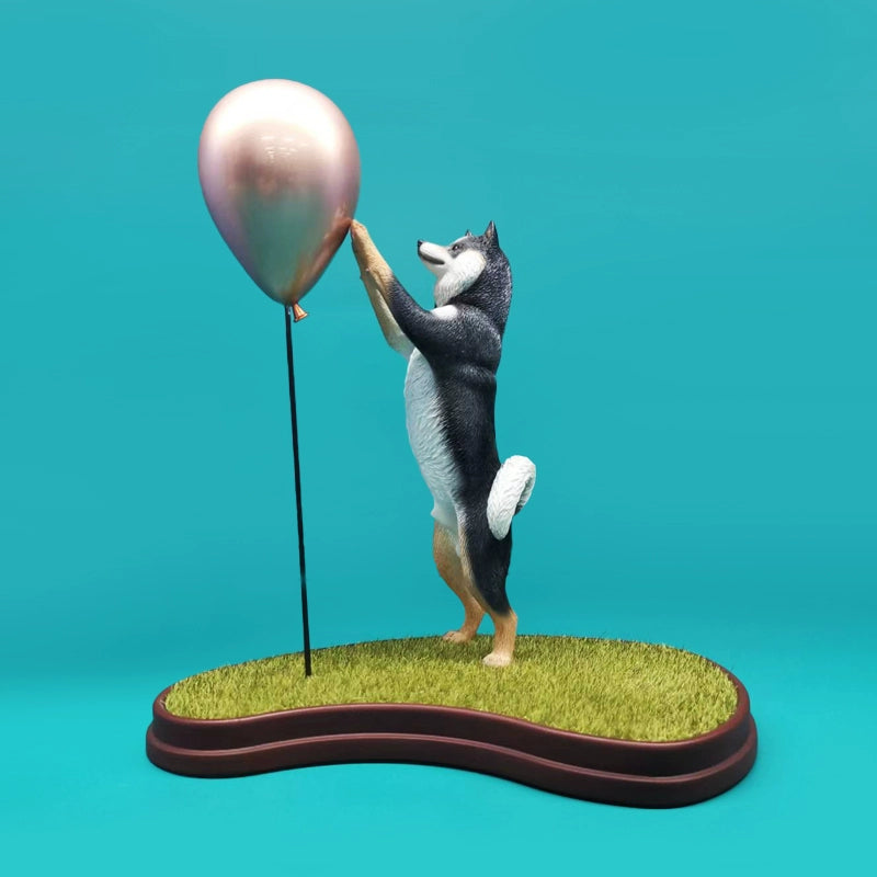  Image Details Image Renamed: 1_6_Acting_Cute_Shiba_Inu_2.0_Model.jpg Product Title 1/6 Scale Acting Cute Shiba Inu 2.0 Model – Adorable Shiba Inu Figurine with Golden Balloon  Product Description Introducing the 1/6 scale Acting Cute Shiba Inu 2.0 model, a charming figurine that perfectly captures the playful nature of the Shiba Inu breed. This delightful model features a Shiba Inu standing on its hind legs, reaching up towards a shiny golden balloon. The figurine is set on a beautifully crafted base that 