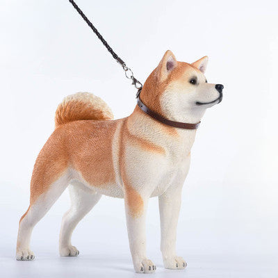 Three 1/6 scale models of Akita dogs, each with a different coat color: dark grey, white, and orange. The models feature realistic fur textures and detailed expressions, capturing the noble and strong nature of the Akita breed.