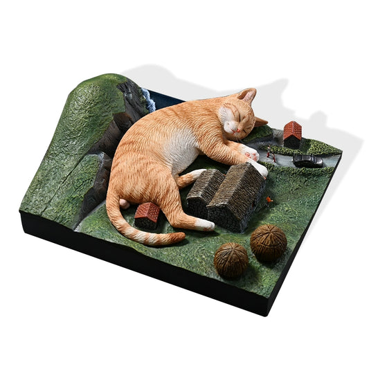 A 1/6 scale model of a giant orange tabby cat sleeping peacefully on a miniature landscape. The scene features small houses, roads, and other objects, emphasizing the cat's enormous size in a whimsical and imaginative setting.