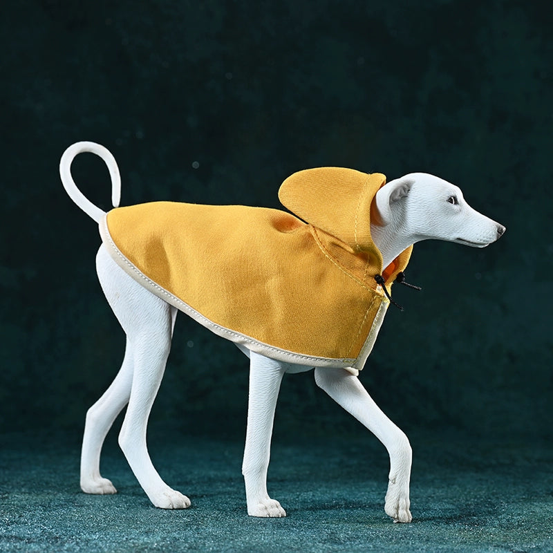 A 1/6 scale model of an Azawakh dog wearing a yellow cape, showcasing a stylish and protective outfit. The dog has a brown coat and a sleek, slender physique.